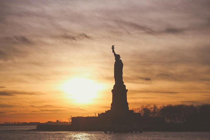 9/11 Memorial Statue of Liberty & Ellis Island Guided Tour Option - Battery Park, Wall Street, and the route through Lower Manhattan