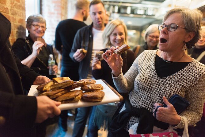 Foods of NY Tours Chelsea Market Food Tour & High Line Park - The first bites: biscuit, jam, and Italian crostata