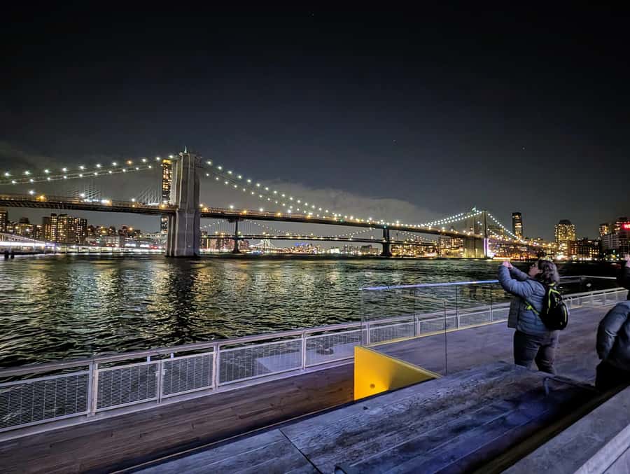 New York City: Guided Private Glass-Top Bus Tour at Night - Pier 17 and the Brooklyn Bridge view