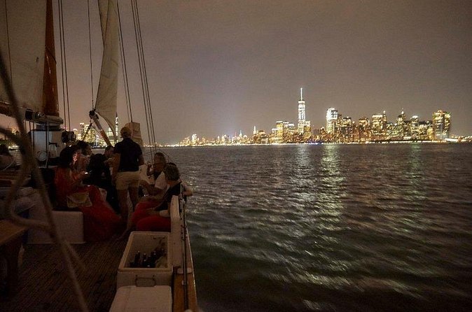 New York City Skyline Night Sailboat Tour - Passing Ellis Island after dark