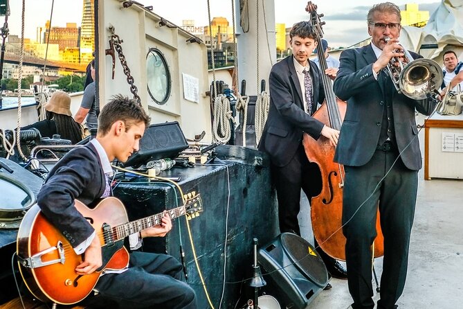 New York City Sunset Jazz Sail aboard Clipper City - The park landmark and Ellis Island