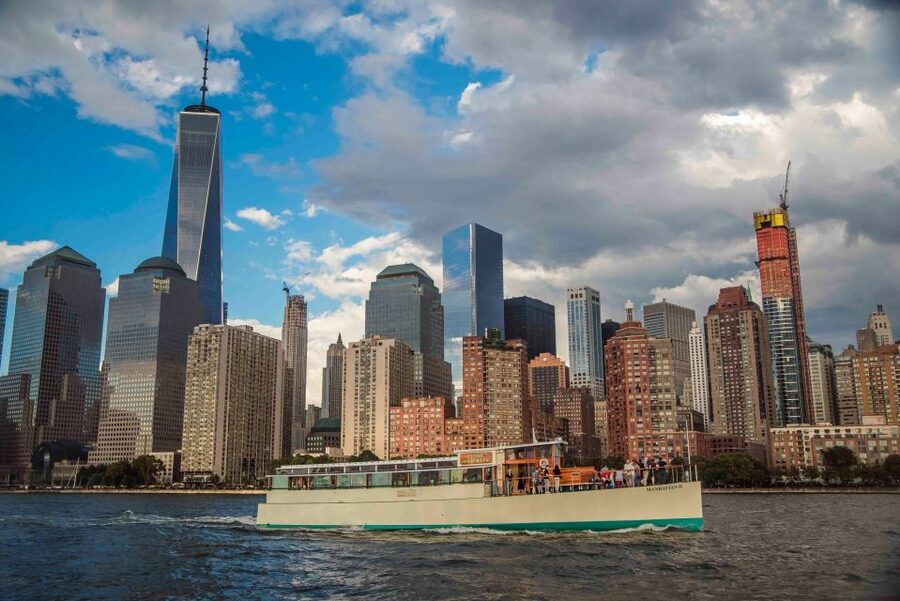 NYC: Night Holiday Lights and Cocoa Cruise - Ellis Island and the Statue of Liberty after dark