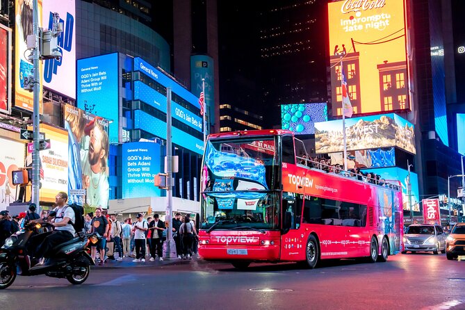 Skyline Night Bus Audio Narrated Tour Experience - Times Square starts the evening with maximum noise